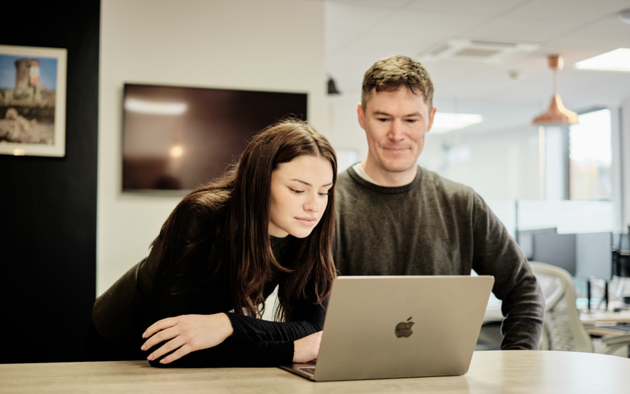Compliance professional overseeing a client onboarding data migration with the
audit trail preserved